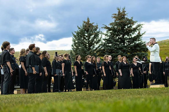 group of people singing outside