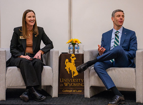 woman and man sitting in chairs