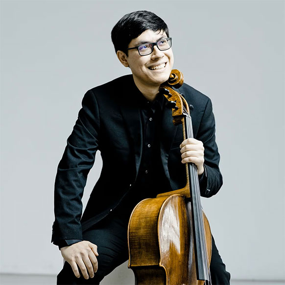 man posing with a cello