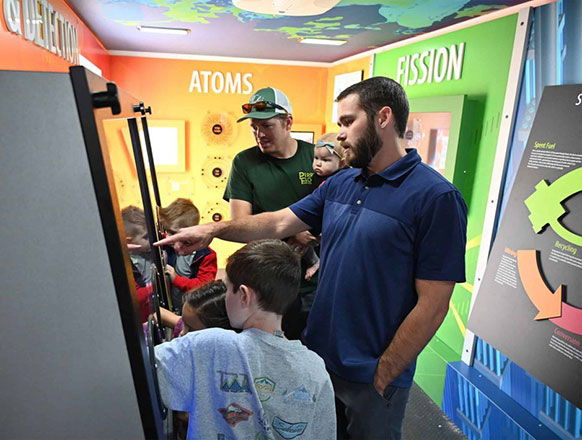 people looking at displays in a trailer