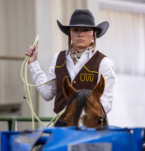 woman on a horse holding a rope