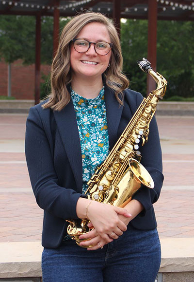 woman holding a saxophone