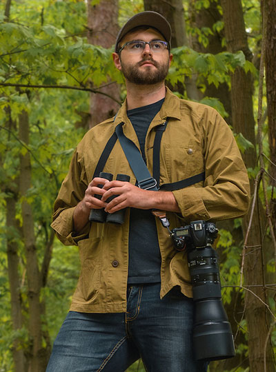 man outside with cameras