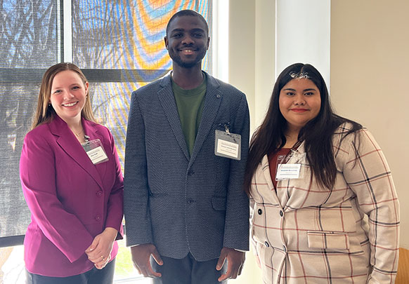 three people posing together