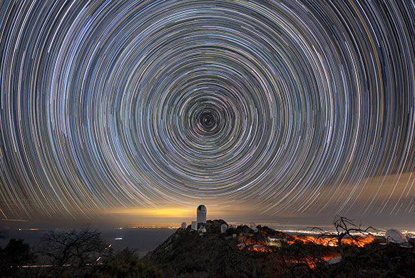 photo of night sky showing star trails