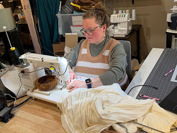 woman using a sewing machine