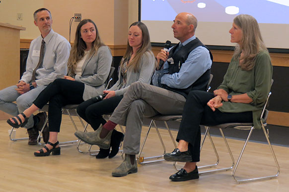 five people sitting in a row
