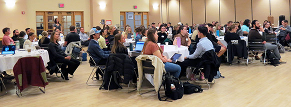 large group of people sitting at tables