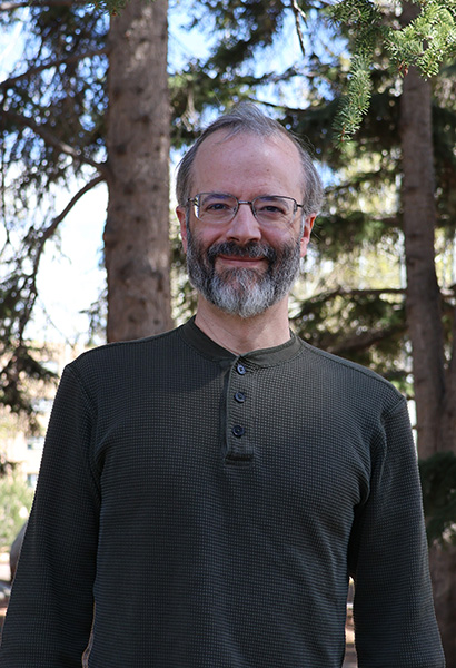 A man stands in the forest