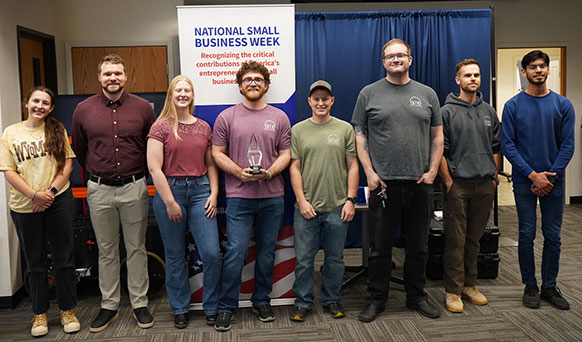 group of people posing in a row