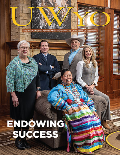 magazine cover showing four people posing behind a Native American woman sitting in a chair