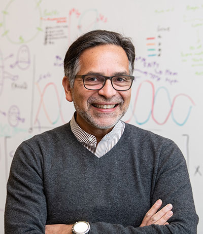 man standing in front of a white board