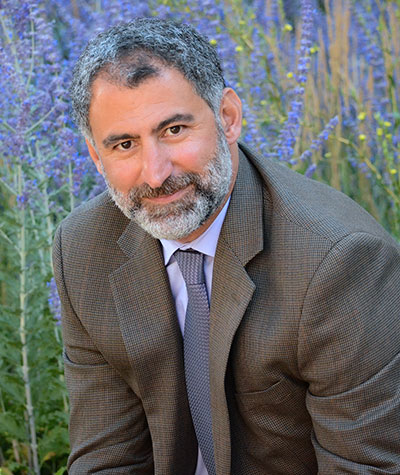man posing in front of flowers