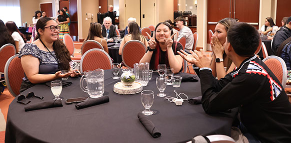 group of people sitting at a table during a banquet