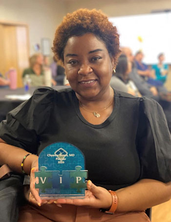 woman holding an award