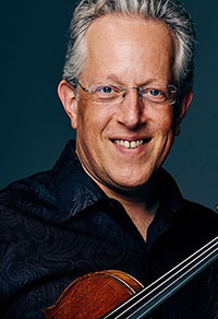 man holding a violin