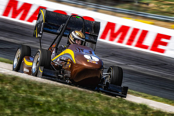 person driving a racecar on a track