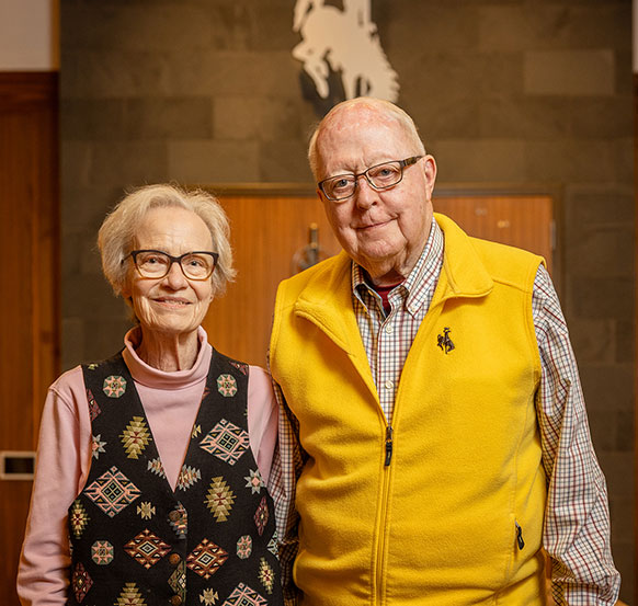 woman and man posing together