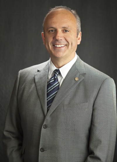 A University of Wyoming distinguished alumnus smiles.