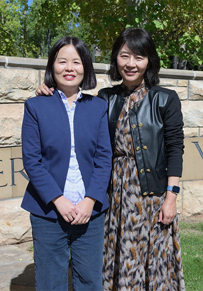 two women standing outside