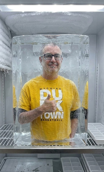 An AI image shows a man in an ice cube giving a thumbs-up.