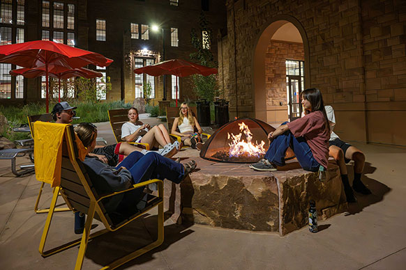 group of people around a firepit