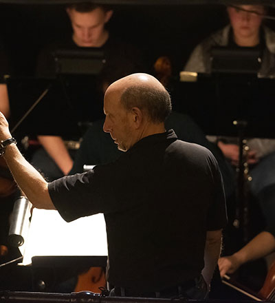 man conducting an orchestra