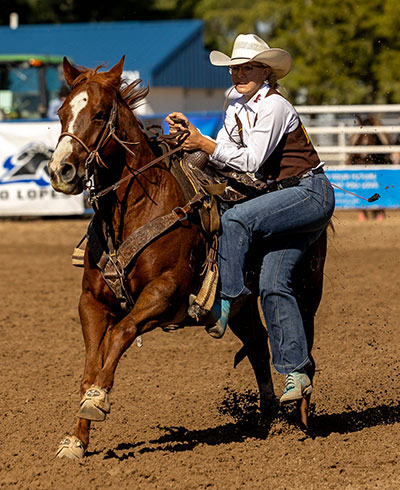 woman dismounting a horse