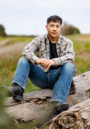 man sitting on a log