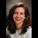 portrait of woman with full dark brown hair