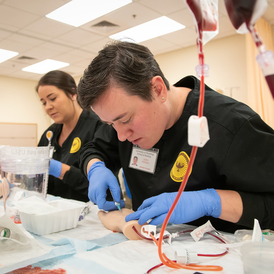 students practice blood draws