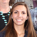 Young woman with dark brown hair and lovely white smile