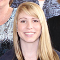 young woman with blond hair and banks and good-natured smile