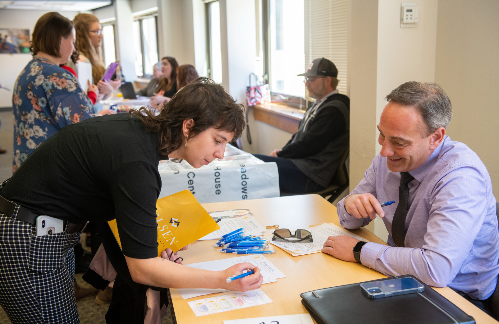student at the healthcare career fair at a table