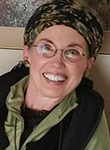 woman with black and green bandana around her hair