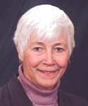 woman with short white hair, dusty pink turtleneck