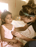 UW student listening to Honduran child's heart