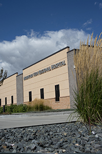 outside of hospital building from the driveway up to the deep blue sky