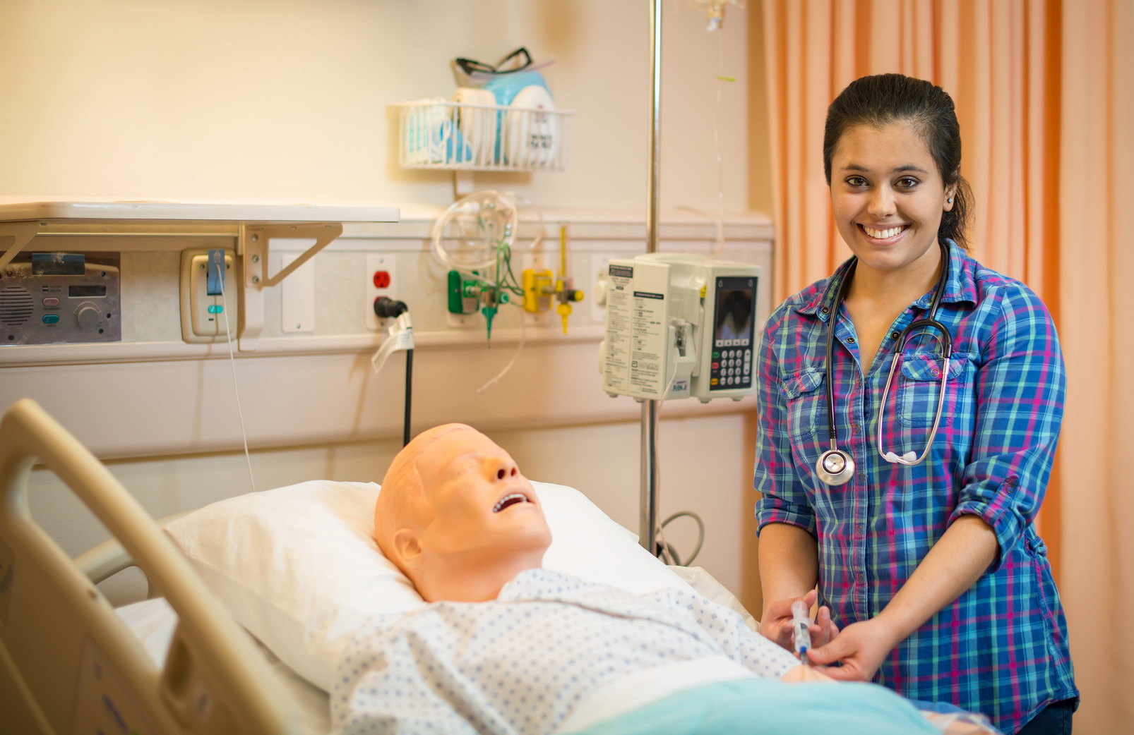 nursing student works in a healthcare setting