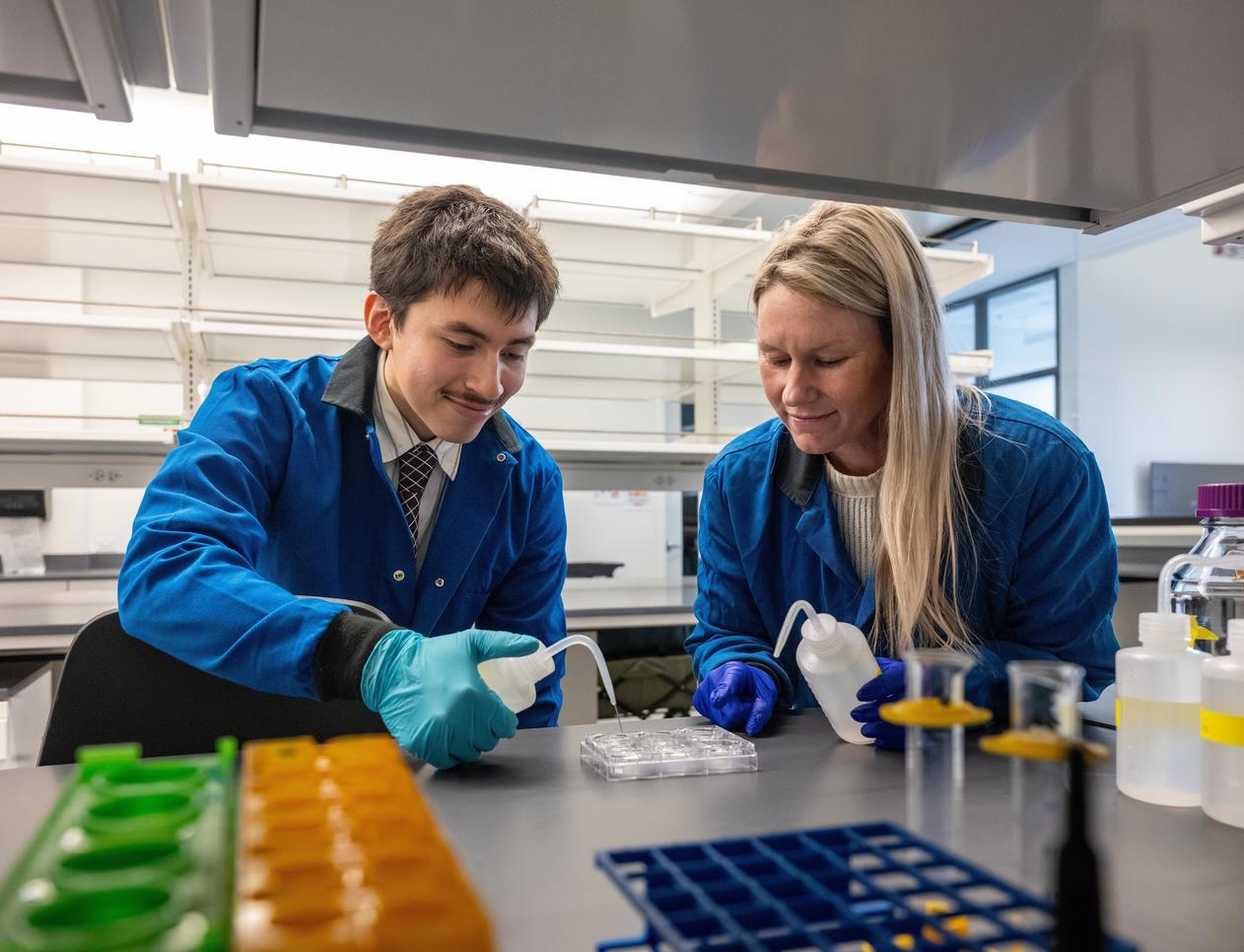 two people work in a lab together