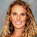 tanned young woman with golden brown wavy hair
