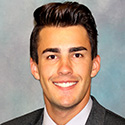 Dark-haired young man in suit and tie