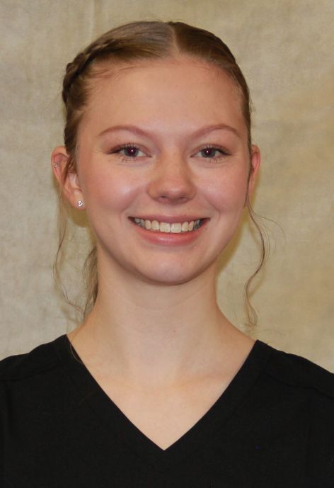 grace harding in black scrubs with yellow patch