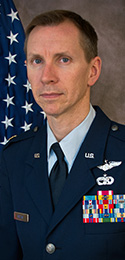military man in dress blues with decorations on uniform