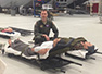 Maj. Samuel Millar teaching aeromedical evacuation at USAF School of Aerospace Medicine
