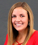 woman with brownish-blonde hair in a red dress