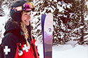 woman in ski gear with medical cross on sleeve