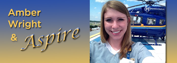 Young woman takes selfie in front of Mayo Clinic helicopter