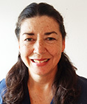 woman with her long brown hair tied back