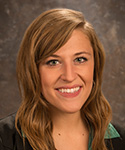 young woman with soft brown hair and highlights